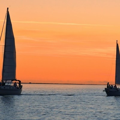 sailboats at sunset