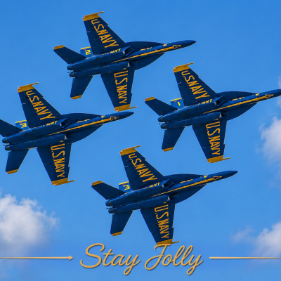 Four blue and yellow jets flying in formation against a blue sky.
